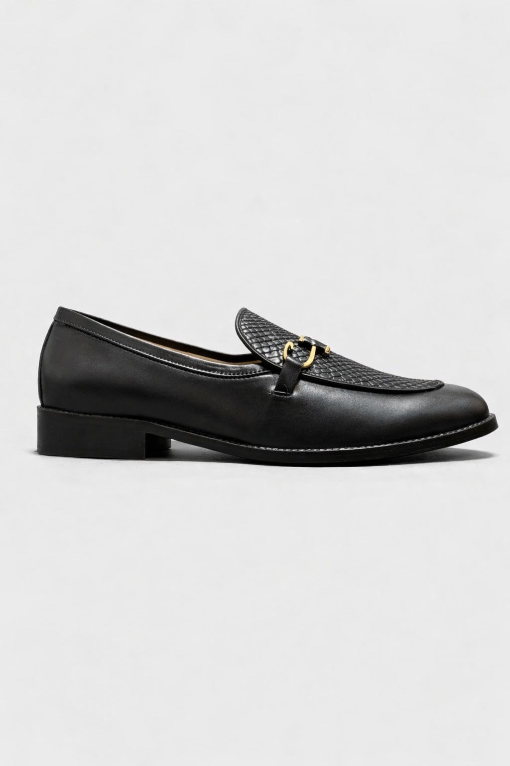 Black leather loafer on white background