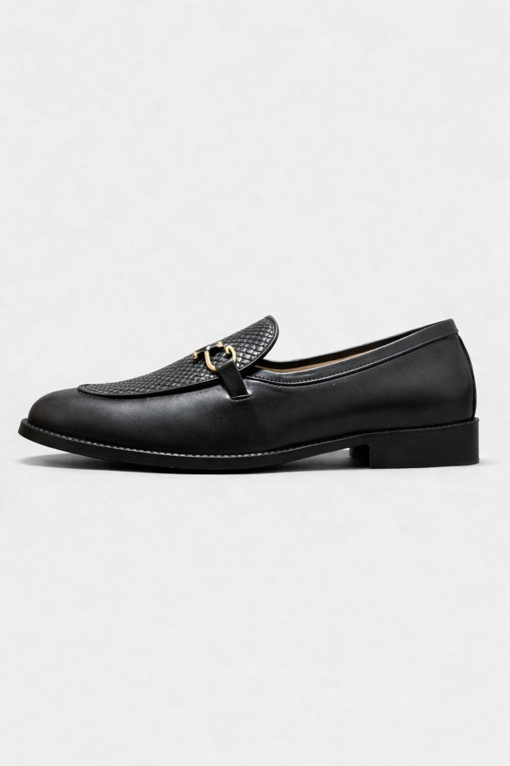 Black leather loafer on white background