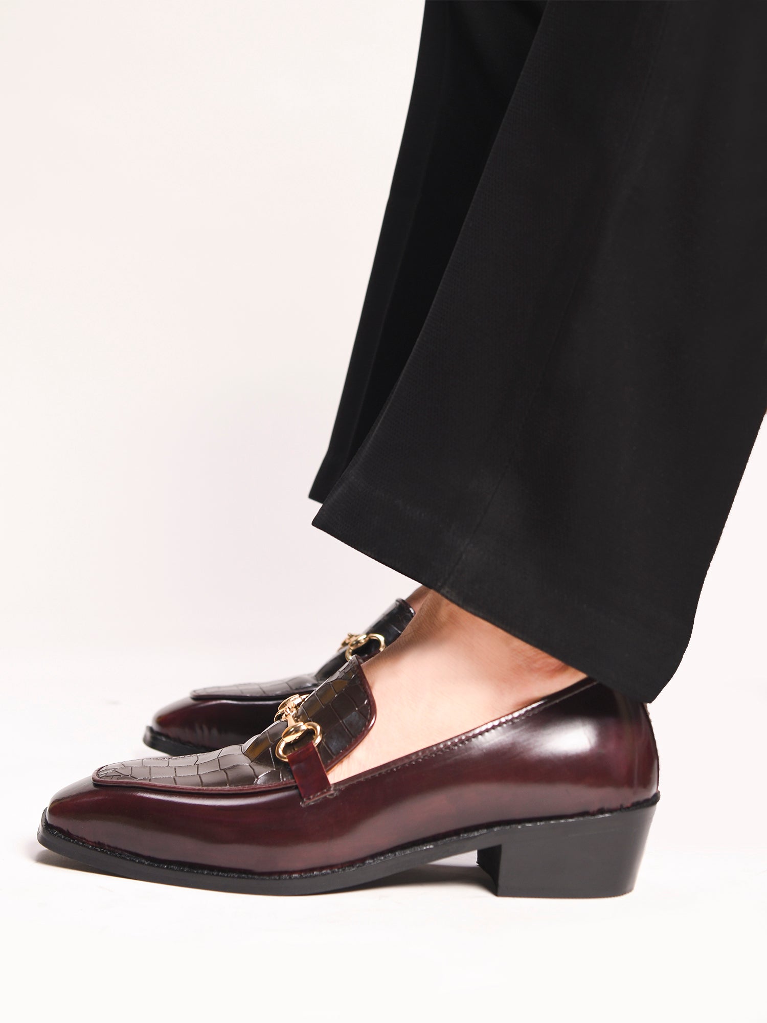 A pair of cherry leather loafer in which it embossed with brown croco leather on top with a golder horesit buckle
