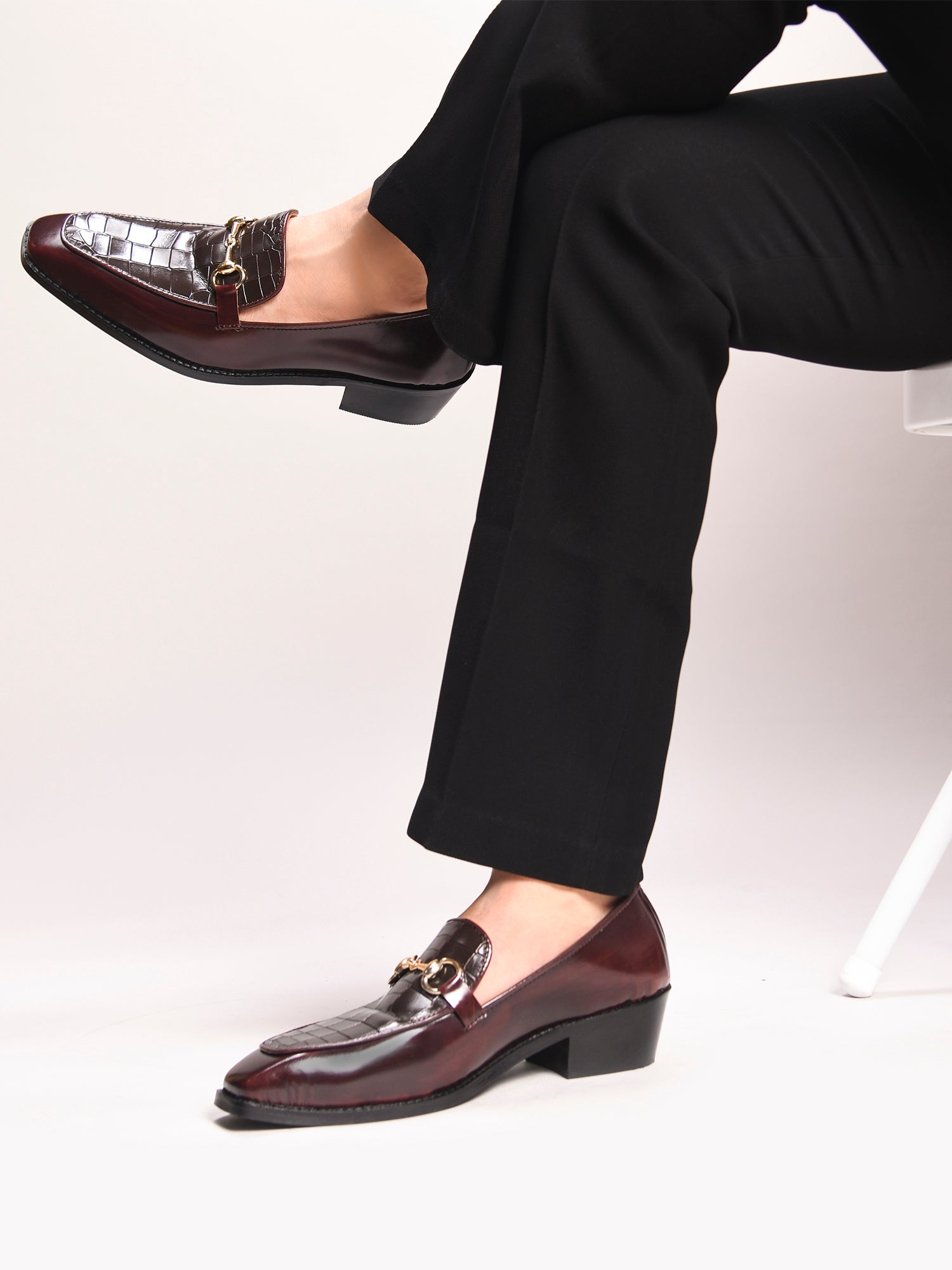 A pair of cherry leather loafer in which it embossed with brown croco leather on top with a golder horesit buckle