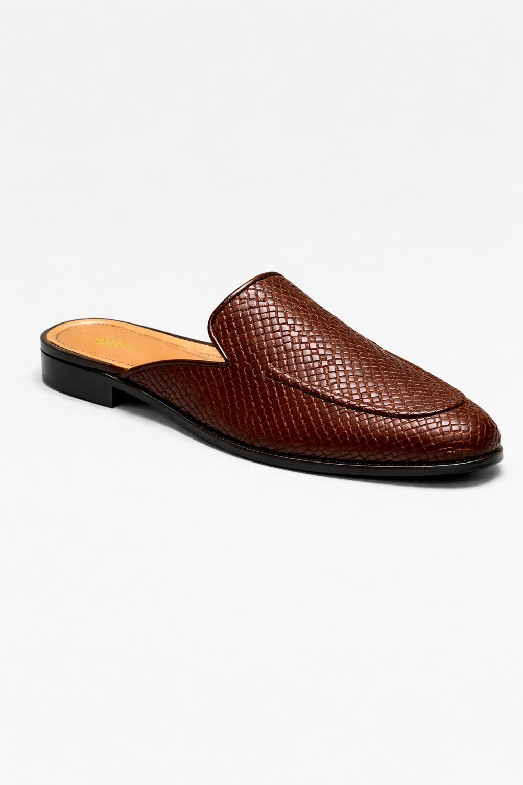 Brown leather slip-on shoe on a white background
