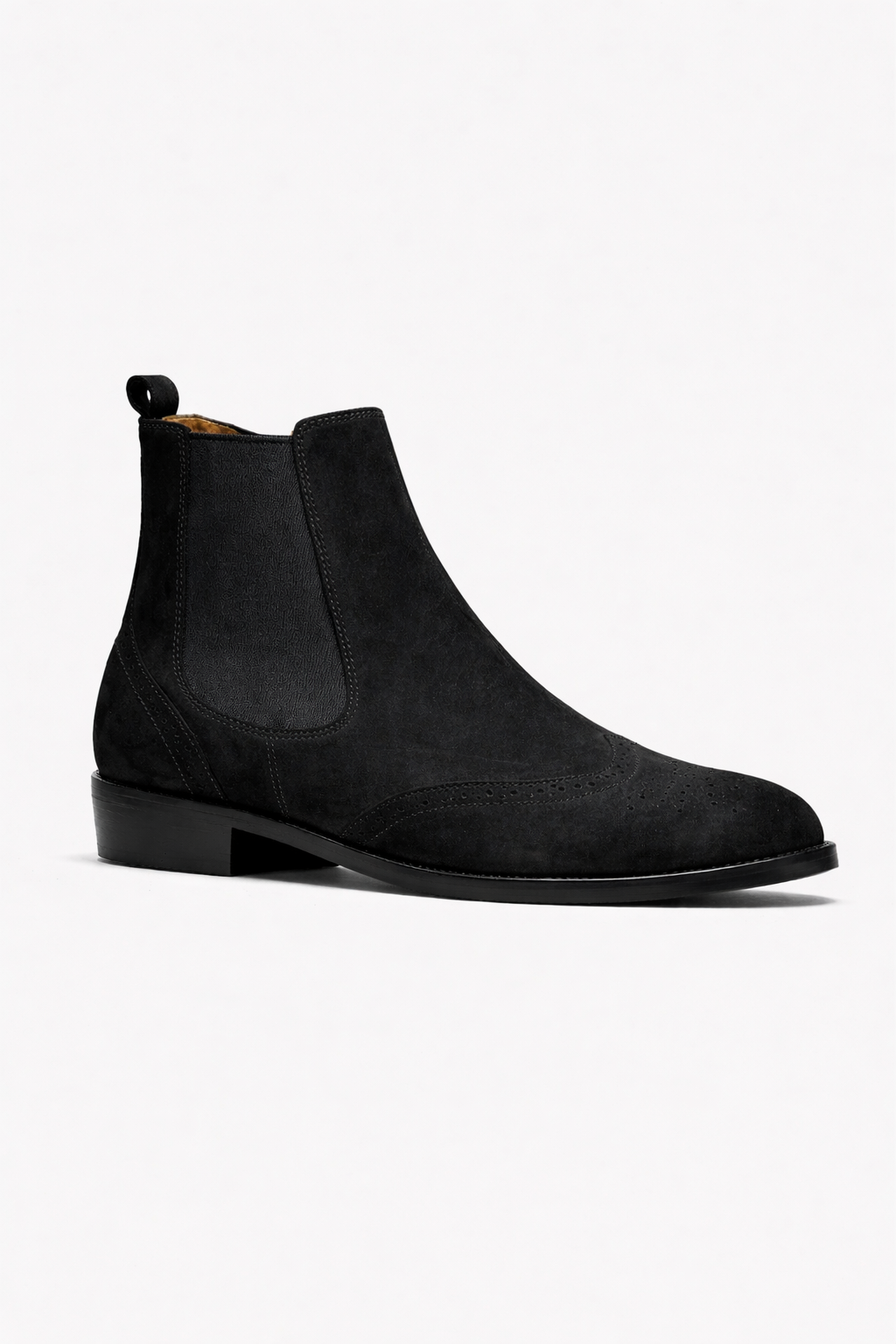 Black suede Chelsea boots on a white background