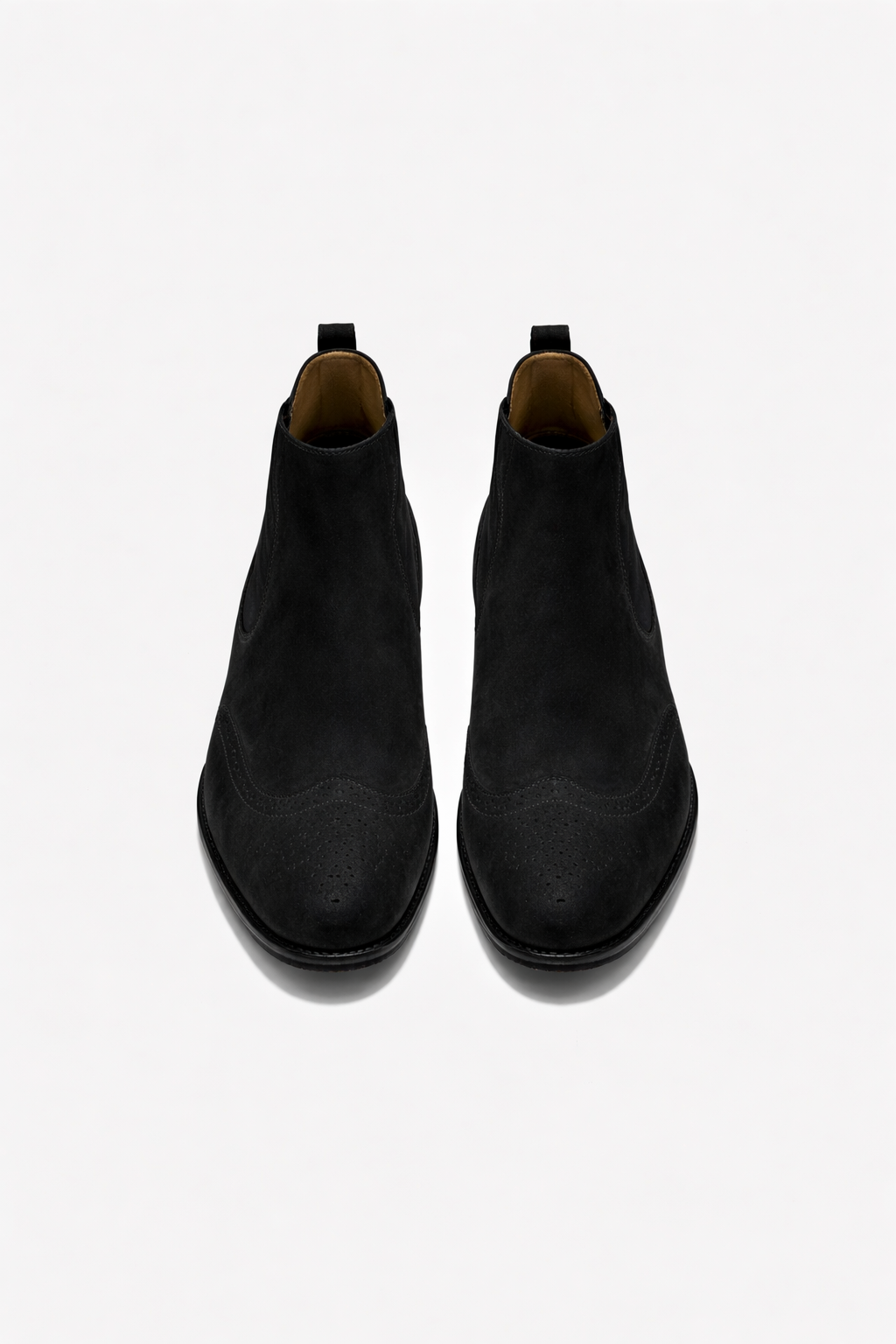 Pair of black Chelsea boots on a white background
