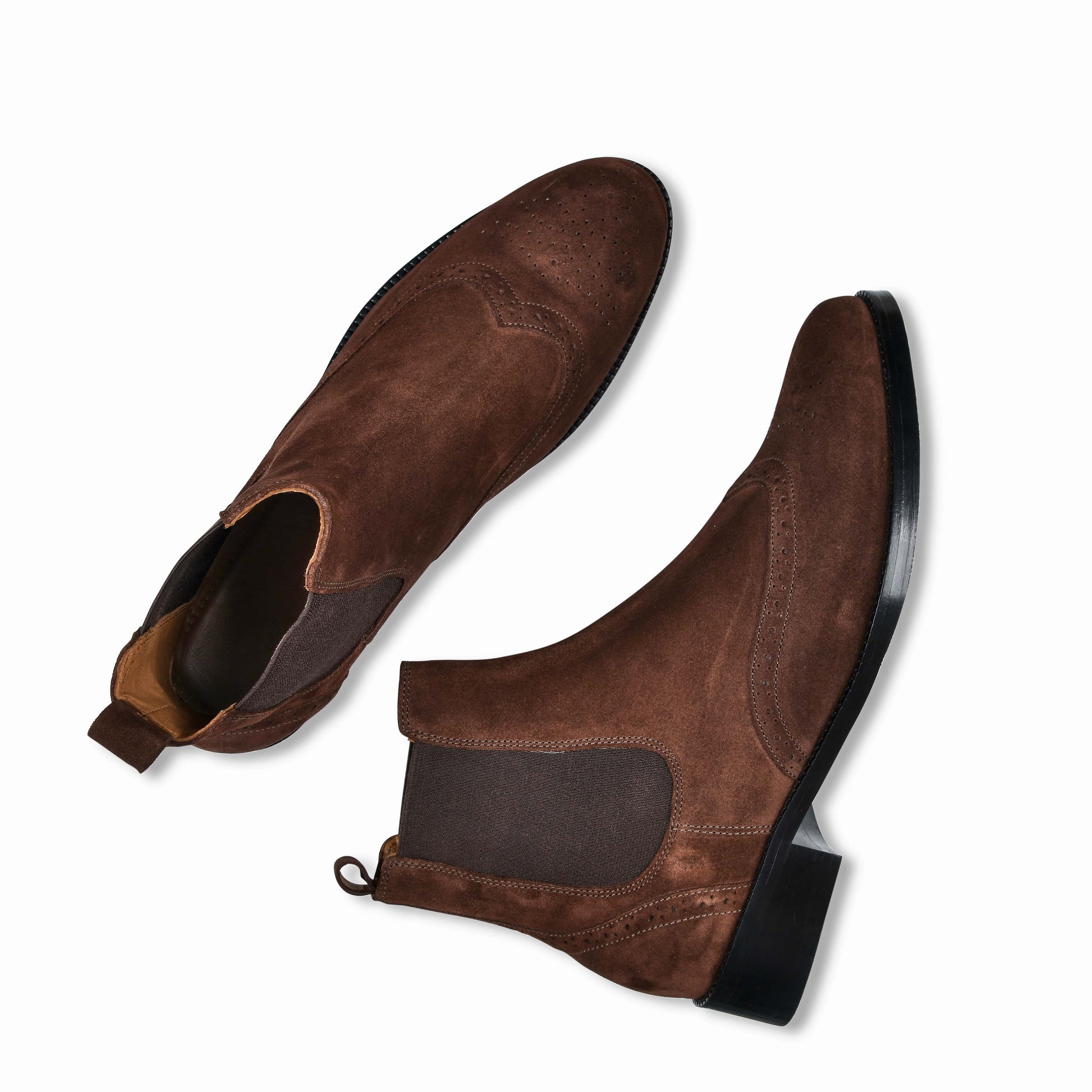 Pair of brown suede shoes on a white background