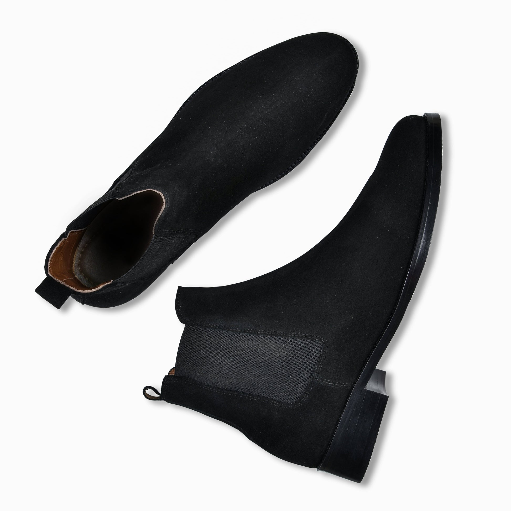 Black suede shoe with open toe and black shoe tree on a white background