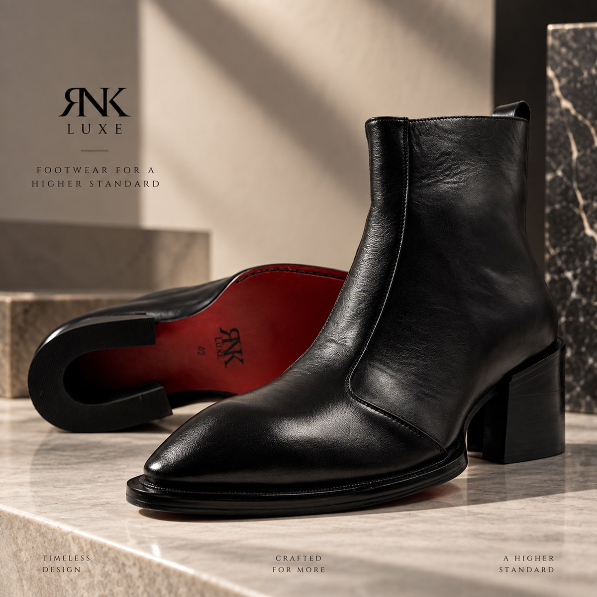 A black leather ankle boot with a block heel and pointed toe, shown alongside another boot turned over to display the red insole. The boots are styled on a marble surface with a beige background and branding text for 'Rnk Luxe'.