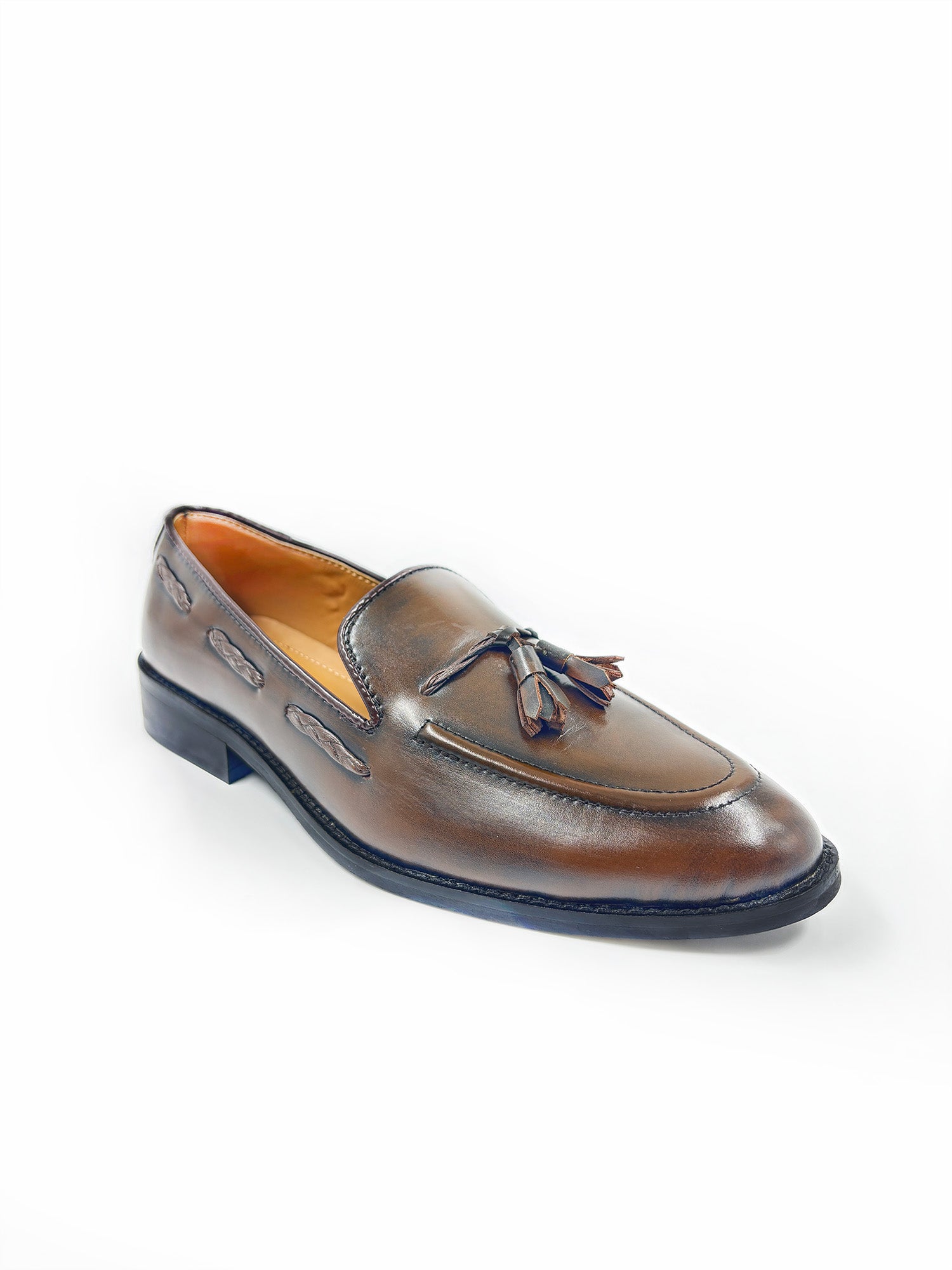 Brown leather loafer with tassel on a white background