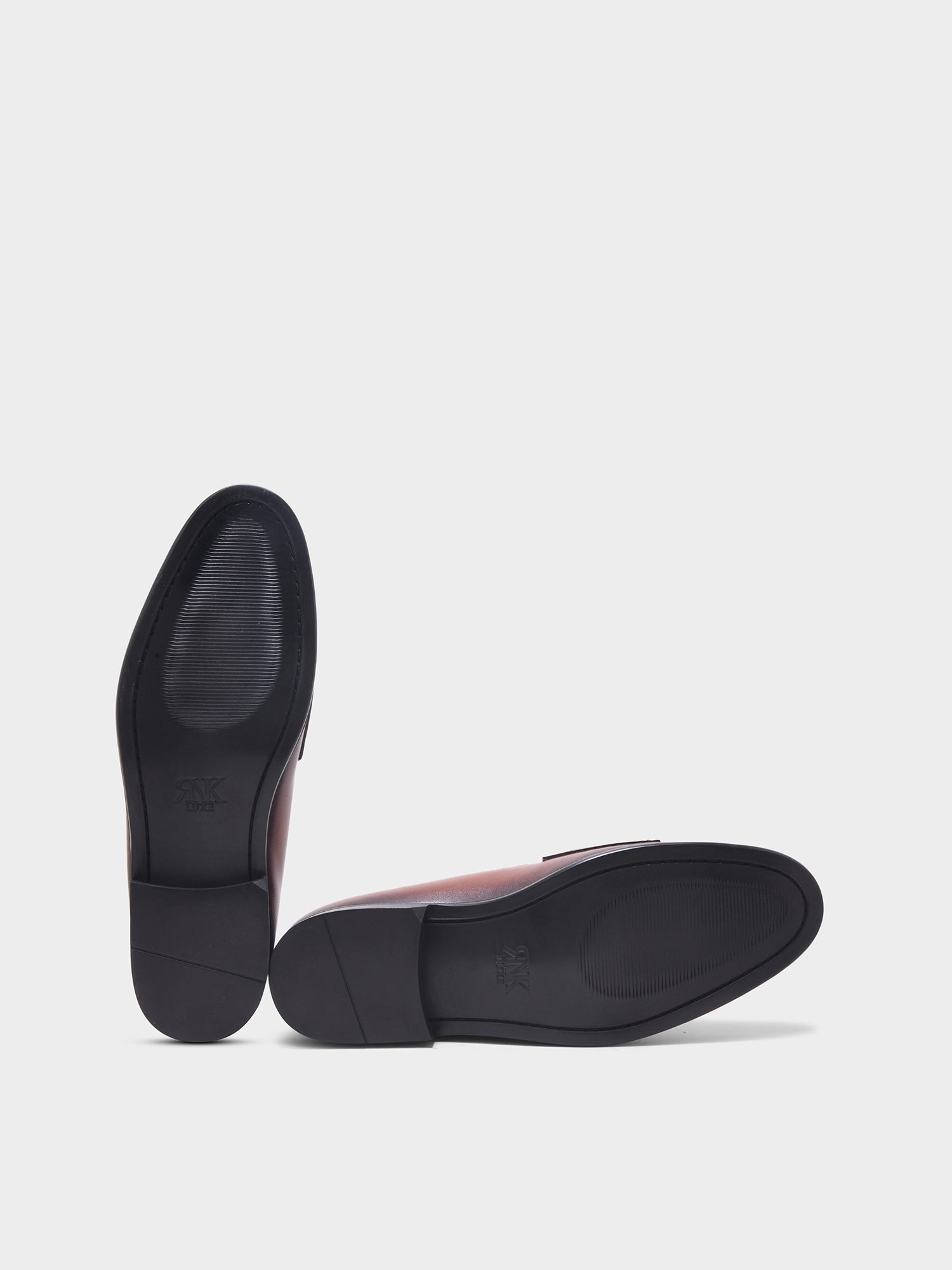 Pair of black shoes on a light gray background